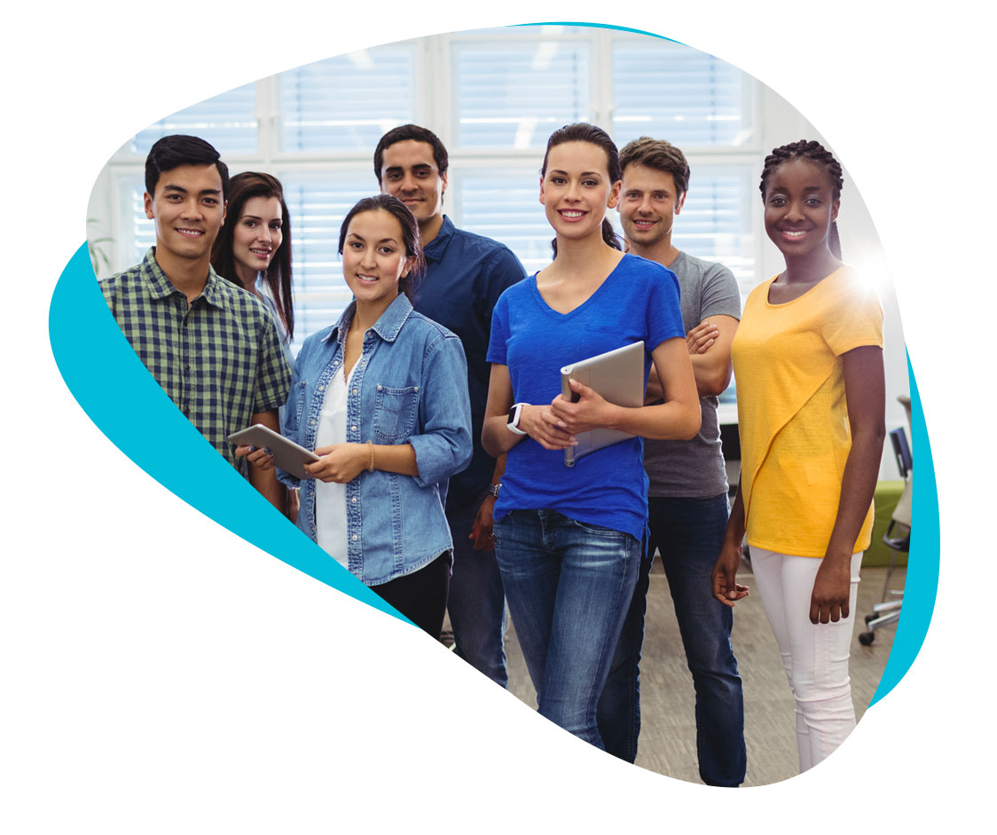 Group of marketing professionals standing together and smiling.